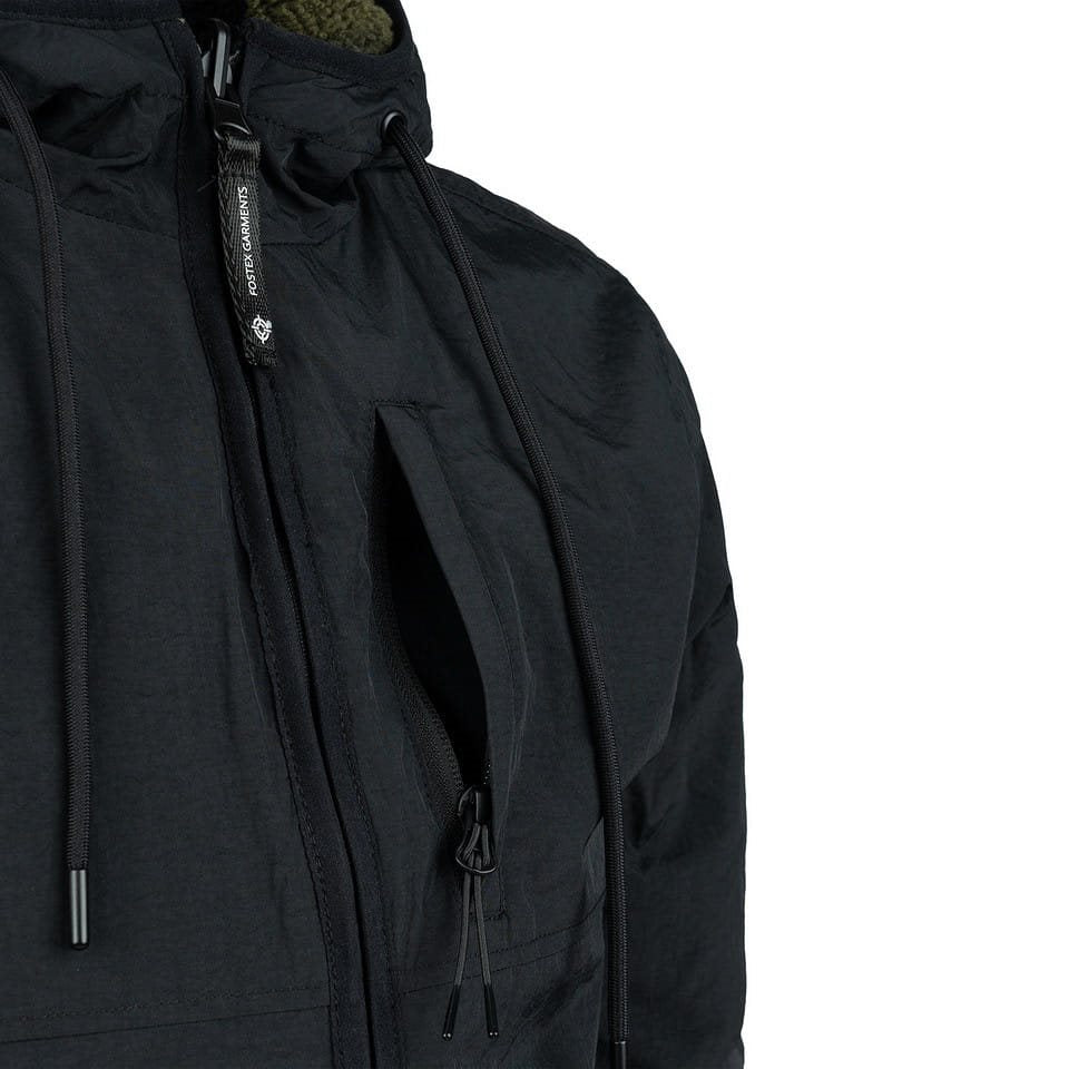 Chaqueta reversible softshell negra y verde con forro sherpa y capucha ajustable