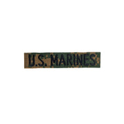 Parche 'U.S. MARINES' velcro negro con patrón MARPAT Woodland