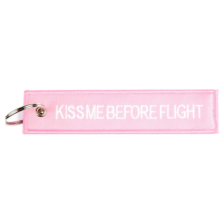 Llavero rosa 'KISS ME BEFORE FLIGHT' aprox. 13 x 3 cm