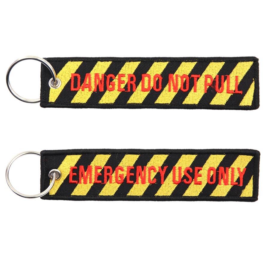 Llavero de nylon con los textos 'DANGER DO NOT PULL' y 'EMERGENCY USE ONLY'