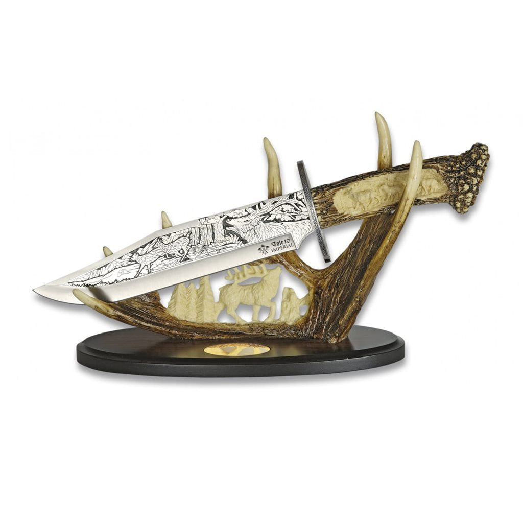 Cuchillo ORNAMENT decorativo con hoja adornada y mango de resina junto a su soporte