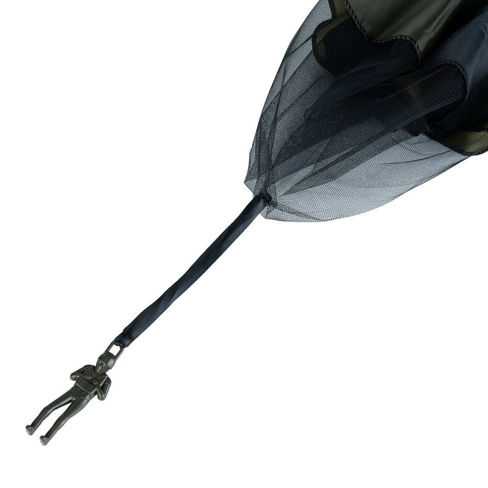 Juguete paracaidista verde con paracaídas en tubo de regalo