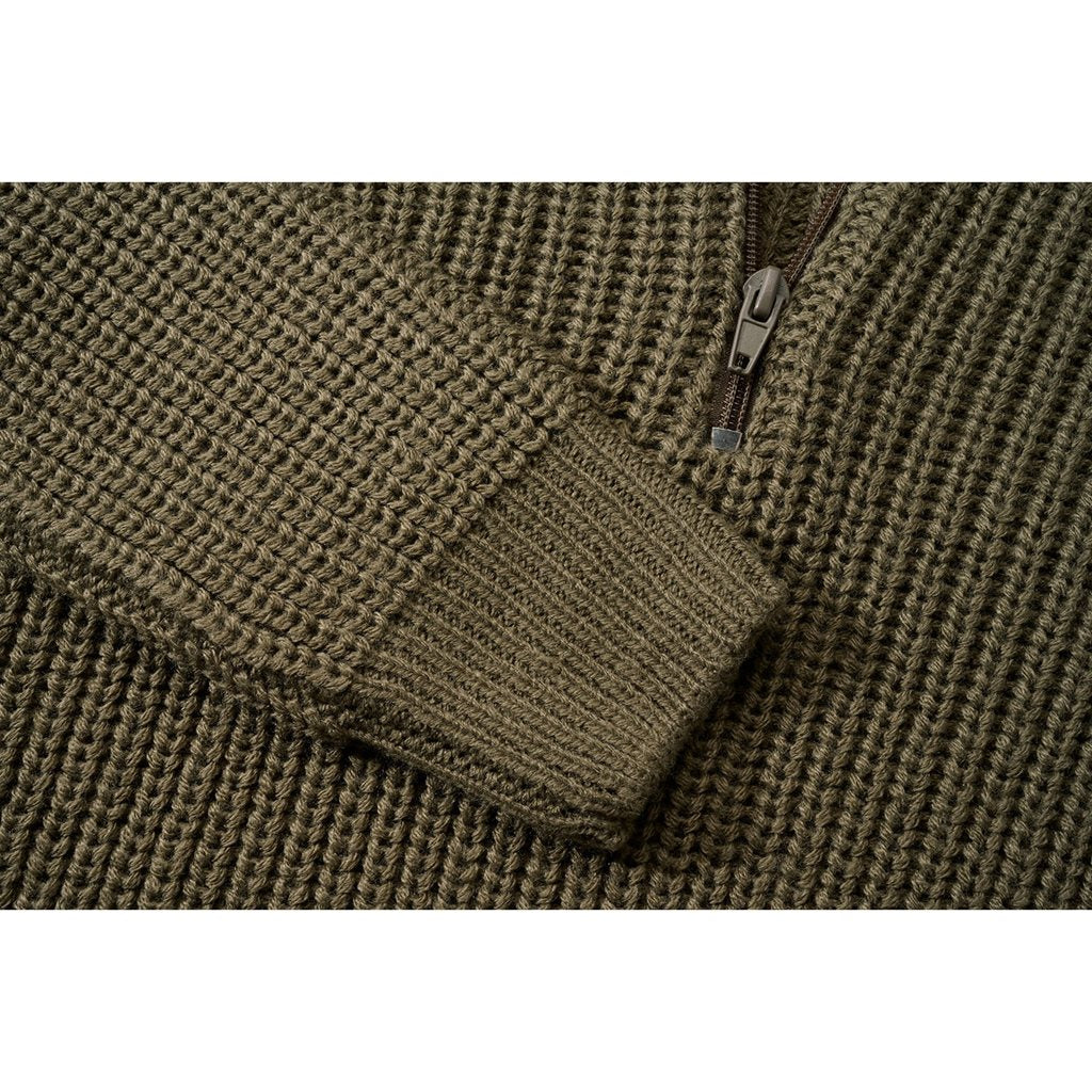 Jersey infantil verde de punto con cuello alto y cremallera