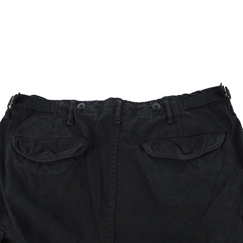 Pantalones M65 para mujer en negro, corte amplio con bolsillos de solapa y cierres a presión