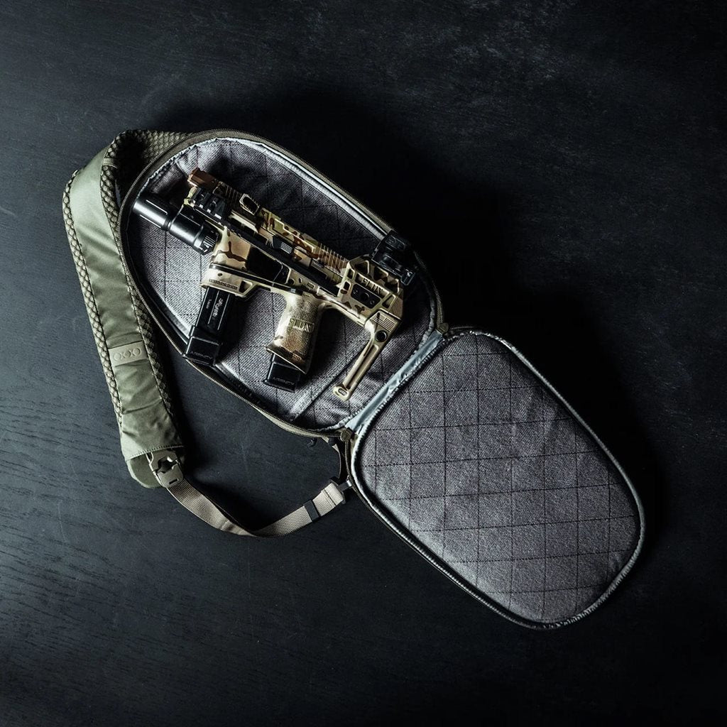 Mochila bandolera FADE SLING gris en nylon 210D rip-stop para transporte discreto de pistolas y PDW