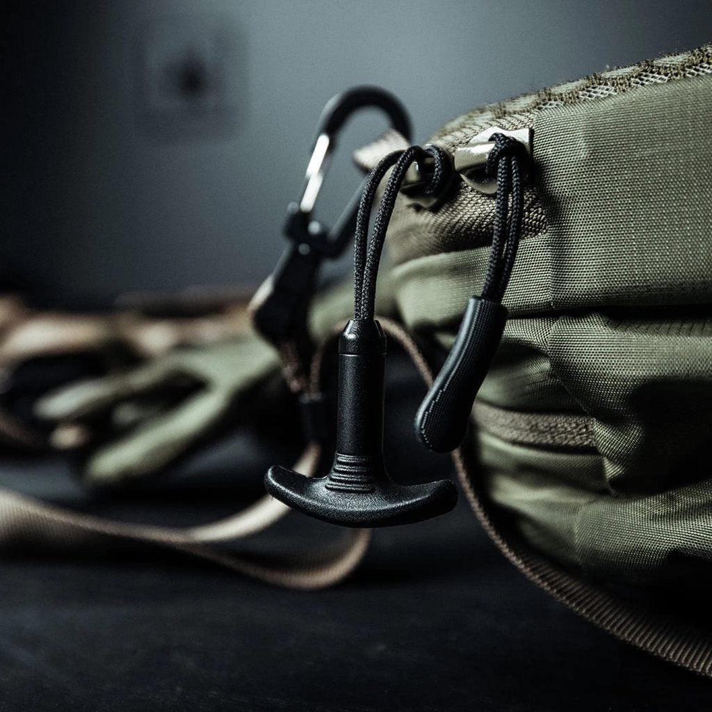 Mochila bandolera táctica FADE SLING gris en nylon 210D rip-stop para transporte discreto