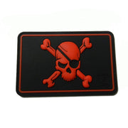 Parche pirata JTG-PSP plástico negro/rojo con calavera y huesos cruzados 70 x 45 mm