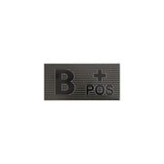 Parche velcro grupo sanguineo B+ en negro y verde, material visible en IR