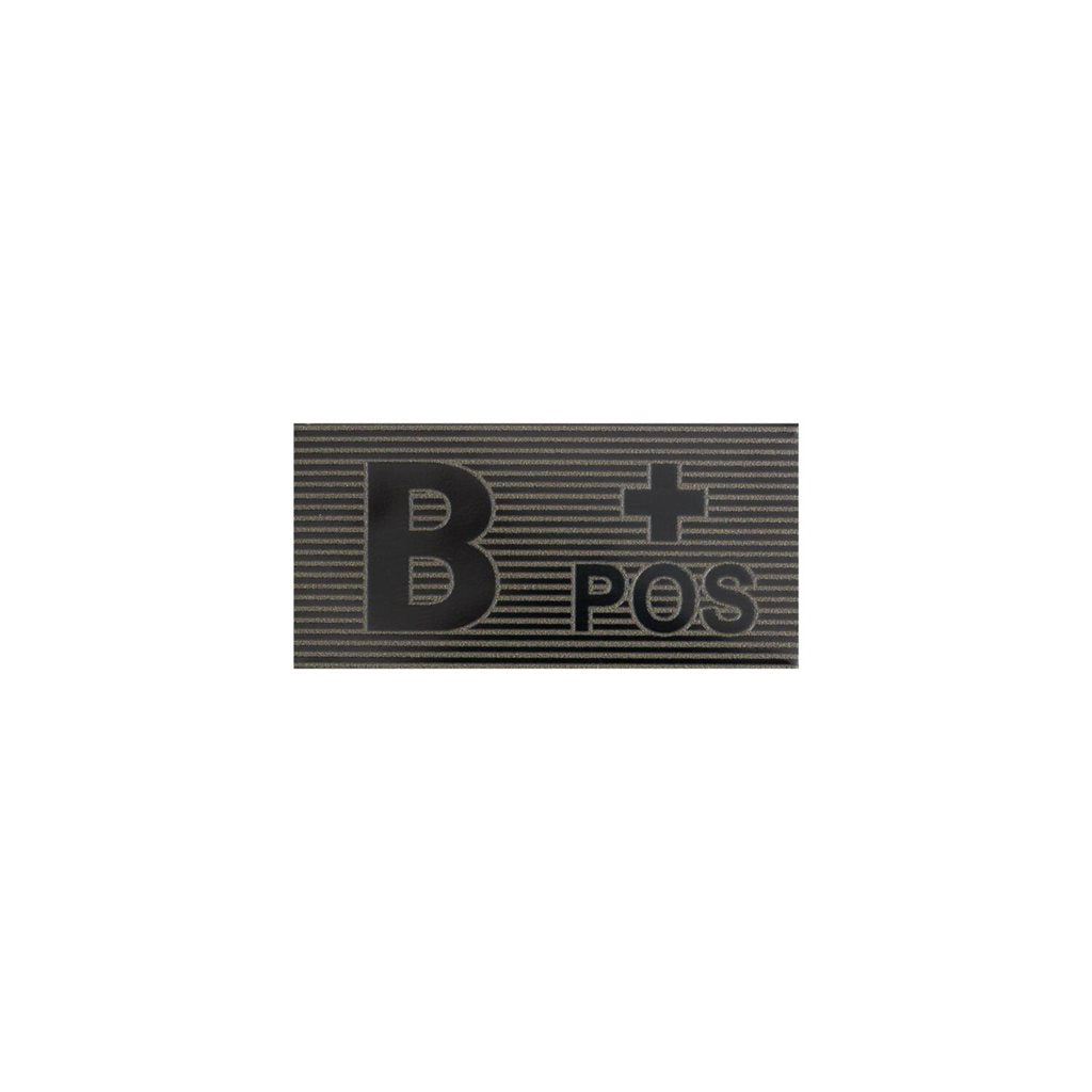 Parche velcro grupo sanguineo B+ en negro y verde, material visible en IR